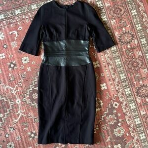Jarbo NWOT Black dress with leather waist. beautiful dress snug fit.
